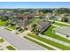 Aerial view of a home showcasing a well-kept lawn, fenced yard, and desirable neighborhood at 5611 Aral Dr, Lakeland, FL 33805
