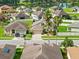 Aerial view of the home in a well-maintained neighborhood, complete with mature palm trees at 5611 Aral Dr, Lakeland, FL 33805