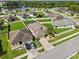 Attractive single-Gathering home with well-maintained yard, two-car garage and view of the lake at 5611 Aral Dr, Lakeland, FL 33805