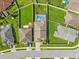 Aerial view of a home with a swimming pool and well-maintained backyard at 5611 Aral Dr, Lakeland, FL 33805