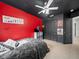 Bedroom with a ceiling fan, tile flooring, and a black closet at 5611 Aral Dr, Lakeland, FL 33805