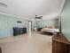 Spacious bedroom featuring neutral walls, tile flooring, and a dark-wood dresser at 5611 Aral Dr, Lakeland, FL 33805