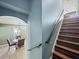View of the dining room featuring wood table set, view of stairs, and arched entryway at 5611 Aral Dr, Lakeland, FL 33805