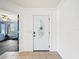 Elegant white front door with decorative glass, leading into a bright and welcoming entryway at 5611 Aral Dr, Lakeland, FL 33805