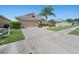 Charming home with a well-manicured lawn, landscaping, and a convenient two-car garage at 5611 Aral Dr, Lakeland, FL 33805