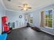 Home gym with rubber flooring, natural light, and exercise equipment at 5611 Aral Dr, Lakeland, FL 33805