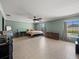 Spacious main bedroom with tile floors, ceiling fan and natural light at 5611 Aral Dr, Lakeland, FL 33805