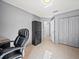 The office features neutral walls, tile flooring, and a large black storage cabinet at 5611 Aral Dr, Lakeland, FL 33805