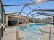 Enjoy this beautiful screened-in pool and spa, perfect for relaxing and entertaining outdoors at 5611 Aral Dr, Lakeland, FL 33805