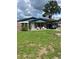 A cute brick home with a carport provides shade for parking in the sun at 5907 Sharon Ln, Lakeland, FL 33809