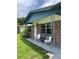 Inviting front porch featuring a cozy seating area, perfect for enjoying quiet mornings or evenings at 5907 Sharon Ln, Lakeland, FL 33809
