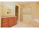 Bathroom featuring granite countertops, a walk-in shower and soaking tub at 6408 Christina Chase Pl, Lakeland, FL 33813