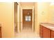 Bathroom featuring granite countertops and access to the main bedroom at 6408 Christina Chase Pl, Lakeland, FL 33813