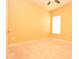 Neutral bedroom with carpet, a window and ceiling fan provides a blank canvas for personalization at 6408 Christina Chase Pl, Lakeland, FL 33813