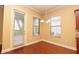 Bright breakfast nook with wood floors, chandelier lighting, and multiple windows with natural light at 6408 Christina Chase Pl, Lakeland, FL 33813