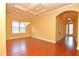 Empty dining room ready for your personal touch, featuring wood floors and elegant recessed lighting at 6408 Christina Chase Pl, Lakeland, FL 33813