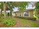 Well-maintained home exterior with manicured landscaping, offering curb appeal and a welcoming presence at 6408 Christina Chase Pl, Lakeland, FL 33813