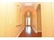 Beautiful hallway with archways and elegant lighting, leading to the entrance at 6408 Christina Chase Pl, Lakeland, FL 33813