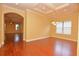 Open dining and living space, with wood floors and views into other rooms of the house at 6408 Christina Chase Pl, Lakeland, FL 33813