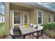 Inviting patio features a dining table set, ideal for outdoor dining and entertaining guests at 6408 Christina Chase Pl, Lakeland, FL 33813