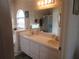 Bright bathroom featuring double sinks, large mirror, and a separate shower and bathtub at 7923 Glenridge E Loop, Lakeland, FL 33809