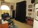 Carpeted office or bedroom features an arched window and a Steelers themed accent chair at 7923 Glenridge E Loop, Lakeland, FL 33809