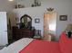 Comfortable main bedroom with a dresser, vases, and bathroom access at 7923 Glenridge E Loop, Lakeland, FL 33809