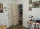 Well-stocked pantry with adjustable shelving for organized storage off the kitchen eating area at 7923 Glenridge E Loop, Lakeland, FL 33809