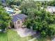 A captivating aerial view showcasing the home's brick exterior and lush, mature landscaping at 351 Crystal Ridge Way, Lake Mary, FL 32746