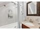 Bathroom with a shower-tub combo, and a vanity with sink and decorative mirror at 351 Crystal Ridge Way, Lake Mary, FL 32746