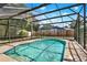 Enclosed in-ground swimming pool within a screened lanai, offering a private outdoor space at 351 Crystal Ridge Way, Lake Mary, FL 32746