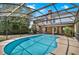 Inviting screened-in pool area, perfect for relaxation and enjoying the outdoors in a private setting at 351 Crystal Ridge Way, Lake Mary, FL 32746