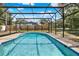 Screened-in swimming pool offering backyard views, providing a perfect recreational area at 351 Crystal Ridge Way, Lake Mary, FL 32746