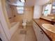 Bathroom features a tub shower combination and updated vanity at 313 S Ridgewood Ave, Deland, FL 32720