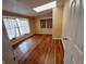 Bright bedroom with hardwood floors and large windows at 313 S Ridgewood Ave, Deland, FL 32720