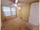 Bedroom with neutral carpet, ceiling fan, and closet at 313 S Ridgewood Ave, Deland, FL 32720