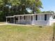 Gray house with carport and fenced yard at 313 S Ridgewood Ave, Deland, FL 32720