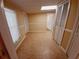 Clean hallway with tile flooring and access to other rooms at 313 S Ridgewood Ave, Deland, FL 32720