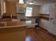 Kitchen with wood flooring and granite countertops at 313 S Ridgewood Ave, Deland, FL 32720