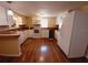 Kitchen with white cabinets and wood floors at 313 S Ridgewood Ave, Deland, FL 32720
