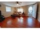 Spacious living room with hardwood floors and access to backyard at 313 S Ridgewood Ave, Deland, FL 32720