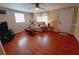 Living room features hardwood floors, neutral walls, and a ceiling fan at 313 S Ridgewood Ave, Deland, FL 32720