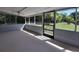 Spacious screened porch overlooking backyard at 313 S Ridgewood Ave, Deland, FL 32720