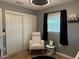 This room features a closet, comfortable chair, and lots of light at 508 Garden N Dr, Lakeland, FL 33813