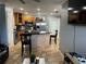 Open kitchen featuring stainless steel appliances, granite counters, and an island with bar seating at 508 Garden N Dr, Lakeland, FL 33813
