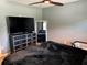 Cozy Main bedroom featuring a large TV and a nice mirror at 508 Garden N Dr, Lakeland, FL 33813