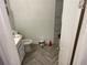 Charming bathroom featuring white cabinets, light fixtures, and modern tile flooring at 105 Byron Pl, Winter Haven, FL 33884