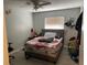 Bedroom featuring crab-patterned bedding, a gray headboard, and a window at 105 Byron Pl, Winter Haven, FL 33884