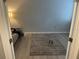 Inviting bedroom features grey wood floors and a cozy sofa, perfect for relaxing at 105 Byron Pl, Winter Haven, FL 33884