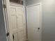 Clean entryway featuring a front door, storage closet, and neutral paint scheme at 105 Byron Pl, Winter Haven, FL 33884